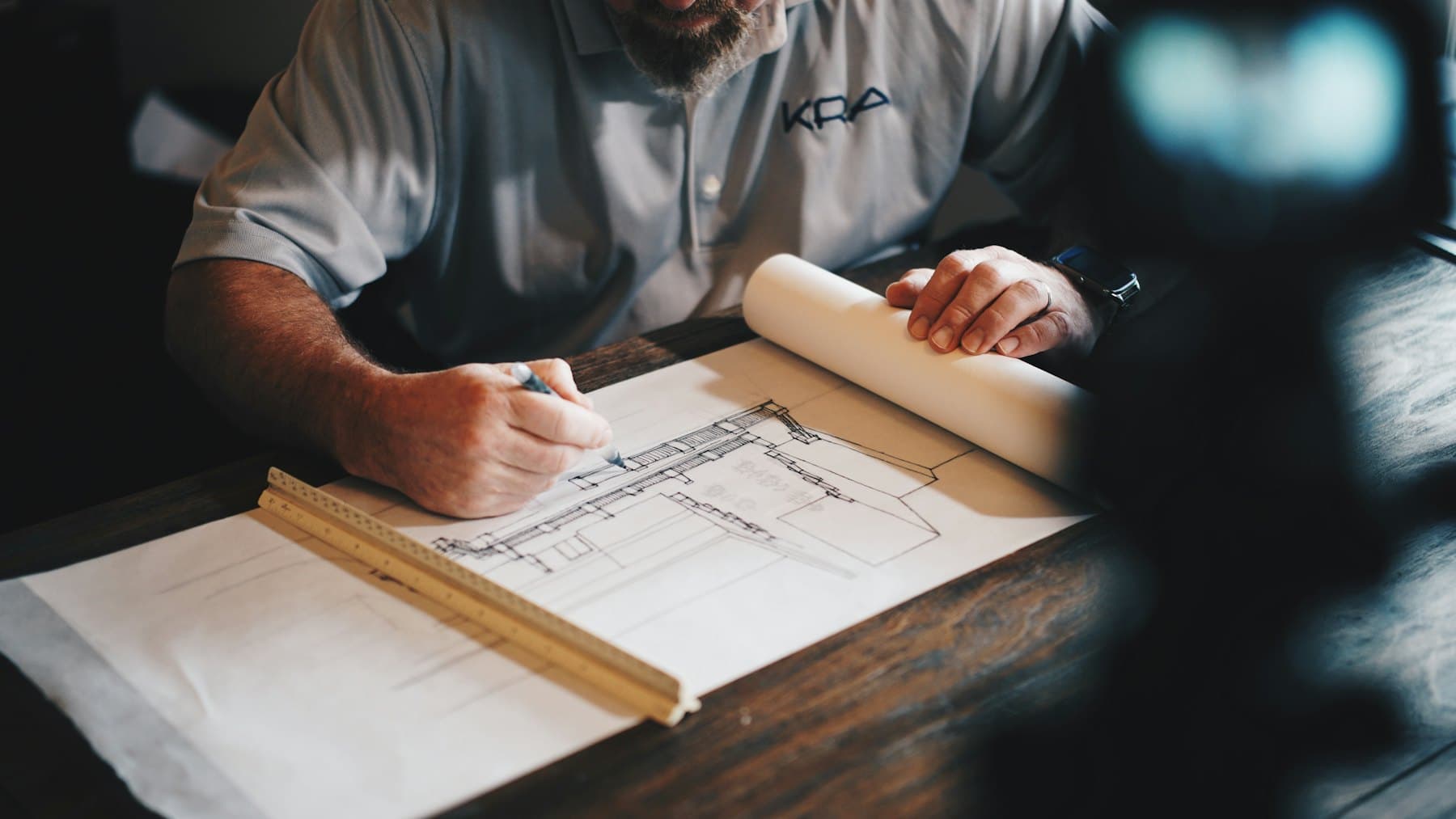 An engineer marking up a construction drawing